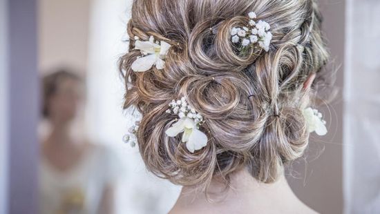 A bride looking in the mirror.